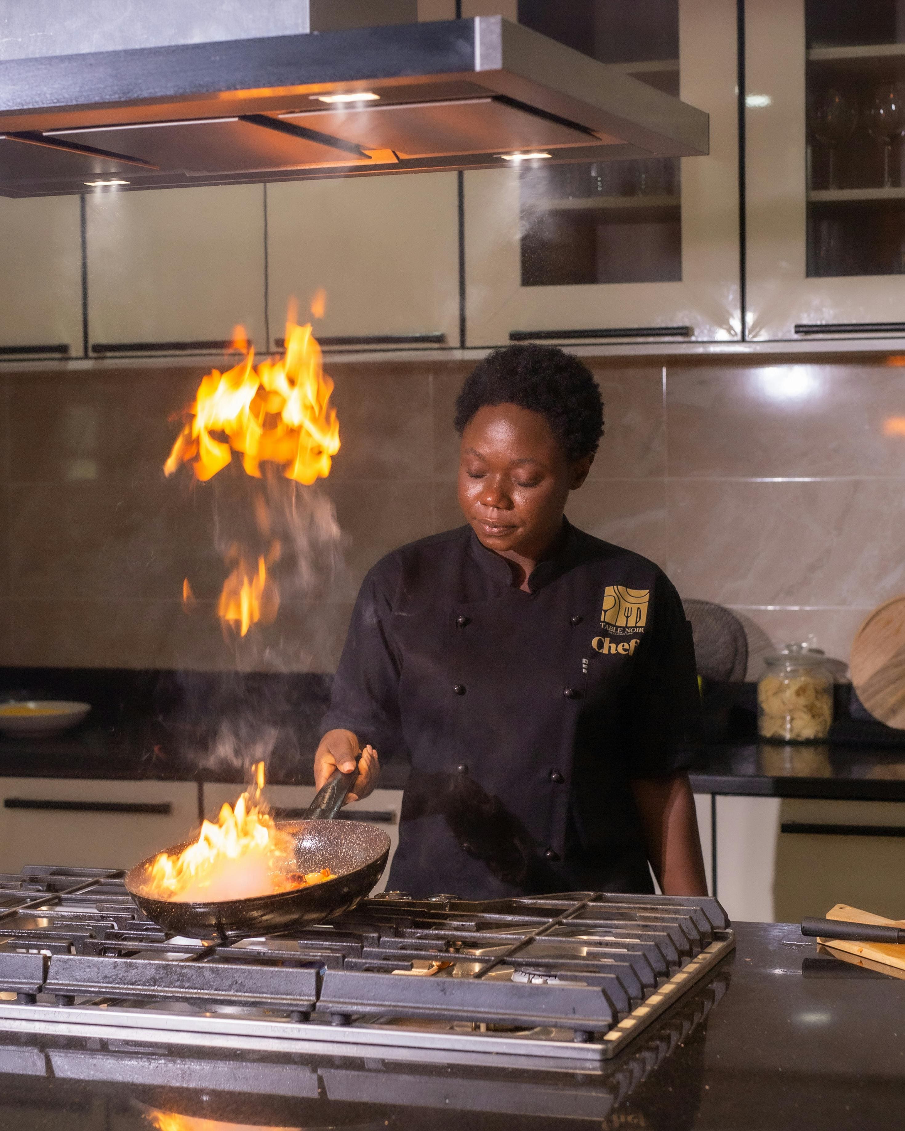 African chef cooking authentic food — Tamub food delivery and recipes app